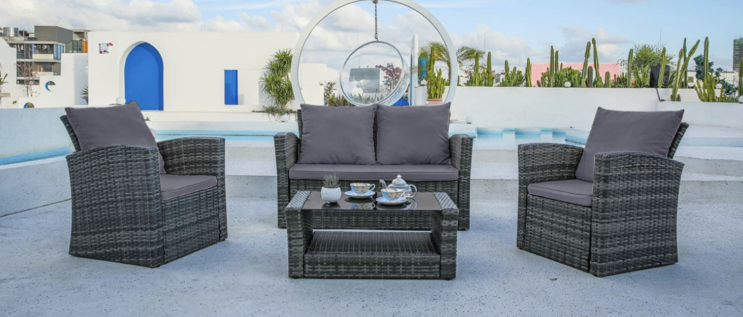 EVRE Grey Roma rattan furniture set on decking with pool background 