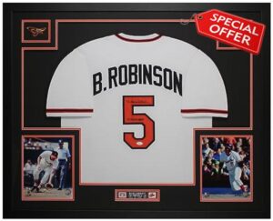Brooks Robinson Autographed White Baltimore Jersey - Beautifully Matted and Framed - Hand Signed By Robinson and Certified Authentic by JSA - Includes Certificate of Authenticity