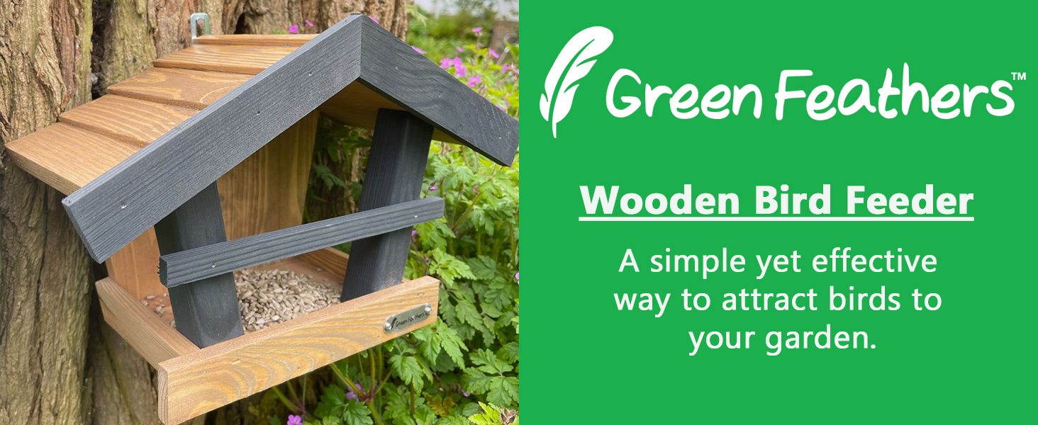 Wooden bird feeder on tree