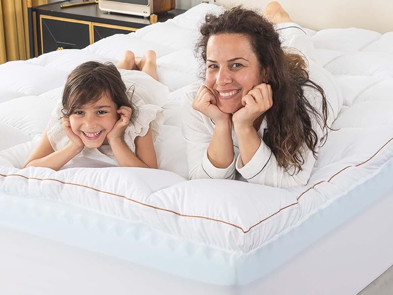 lay on the ultra-soft mattress topper happily
