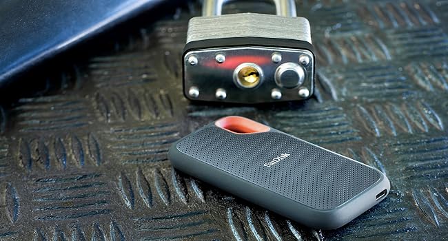Portable SSD falling through the air next to a shoe
