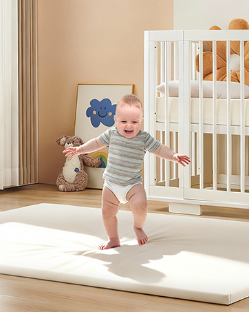 A baby walking on Attababy 70.9"x59" rectangle play mat
