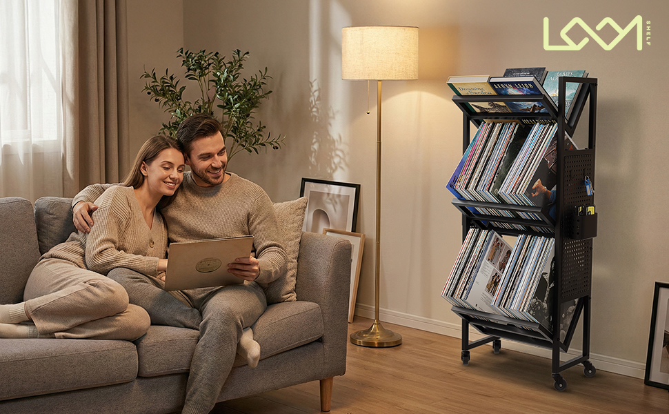 LoomShelf rolling book cart with black metal frame and angled shelves in living room setting