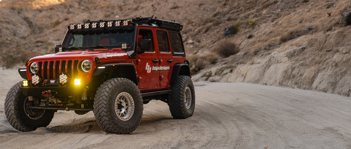 jeep wrangler off-road in desert with baja designs off-road led lights