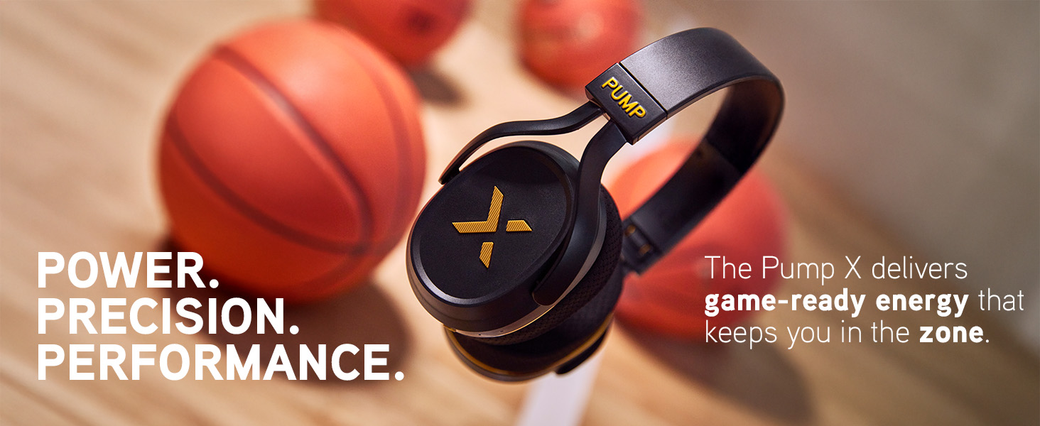 Close up of black and gold Pump X headphones near basketballs, showcasing bold design and detail