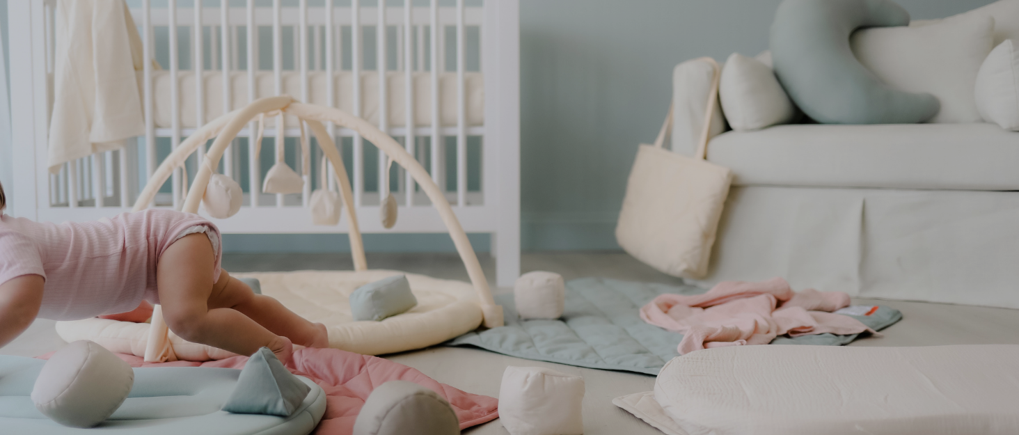 Range of Snuggle Me products lay out on floor