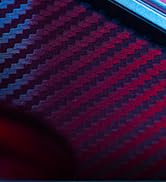 Close-up abstract photograph showing blue and pink illuminated patterns, possibly keyboard or electronic device lighting.