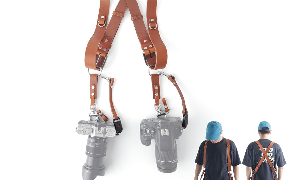 camera hanging at hip on leather shoulder harness over jacket