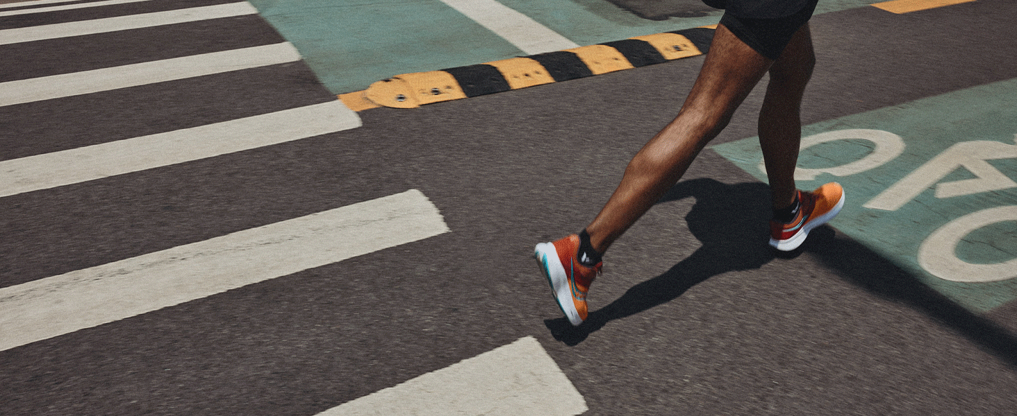 runner crossing an intersection