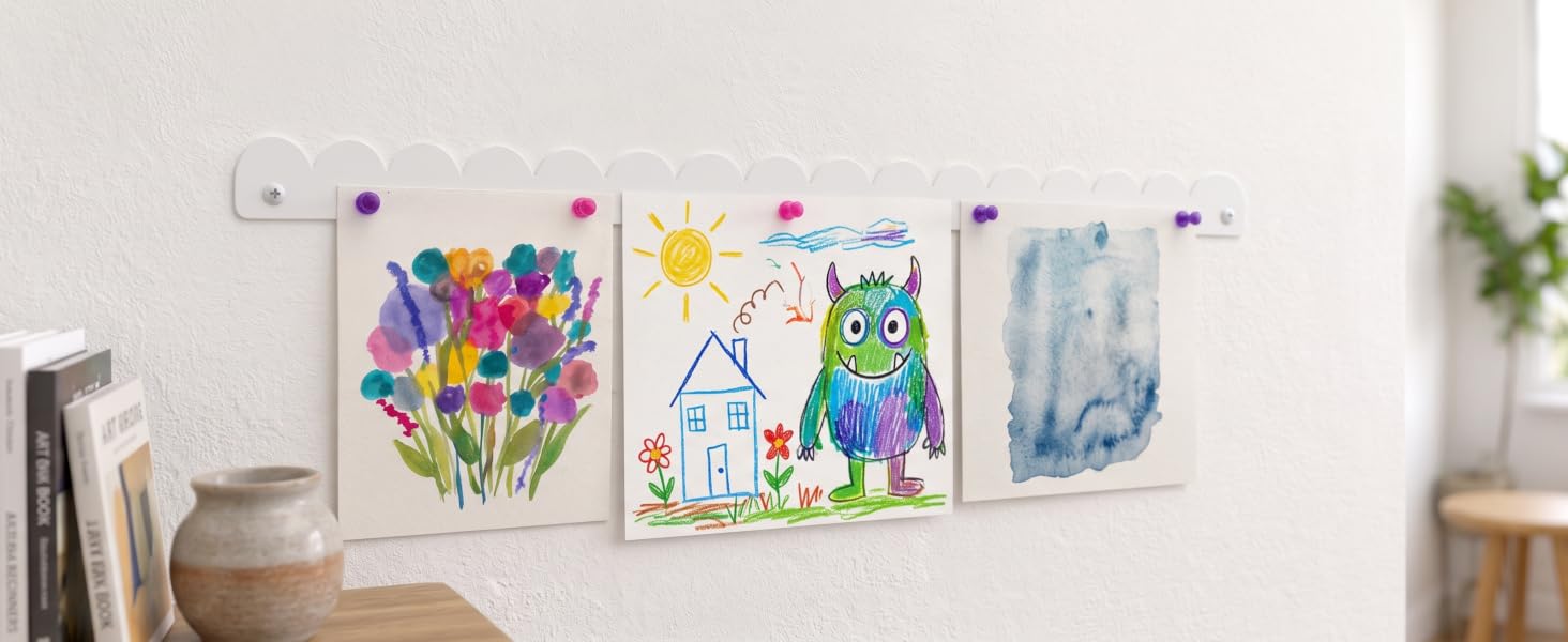 White scalloped magnetic kids art display holding colorful children’s artwork with push-pin magnet