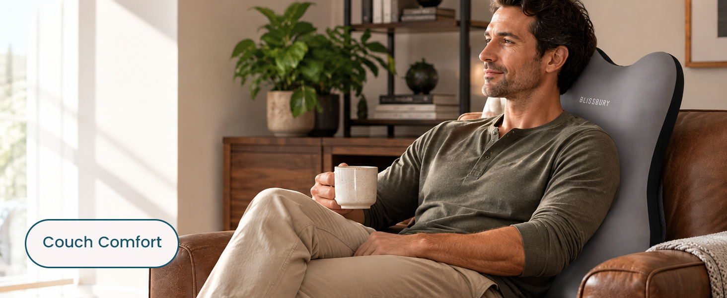 BLISSBURY backrest cushion supporting a man reading while sitting up in bed.