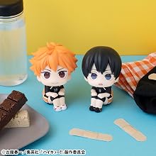 One Piece megacat project blind box lineup in front of a burger and bottle of ketchup