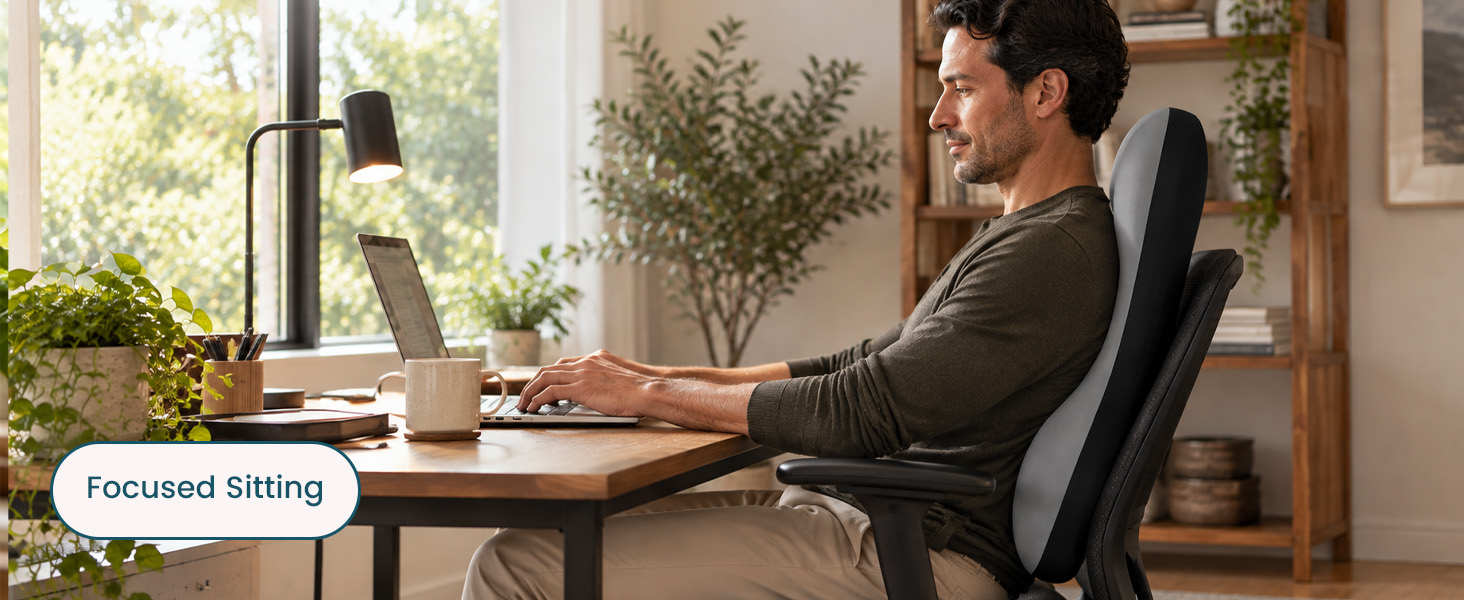 BLISSBURY backrest cushion supporting a man working at a desk in an office chair.